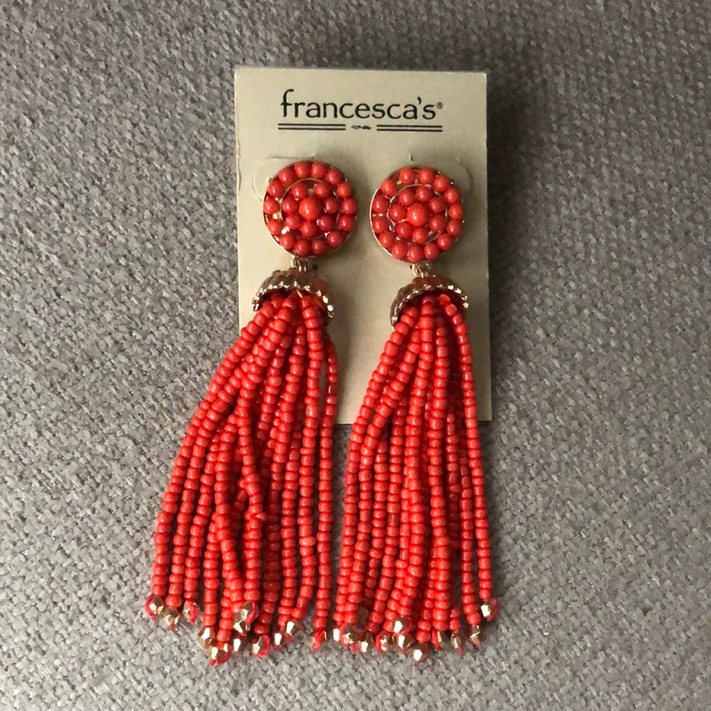 Coral beaded tassel statement earrings